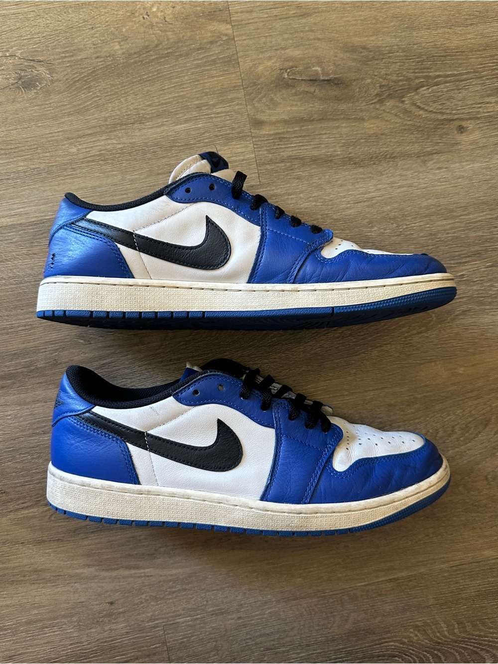 Jordan Low Top Sneakers in White, Blue, and Black
